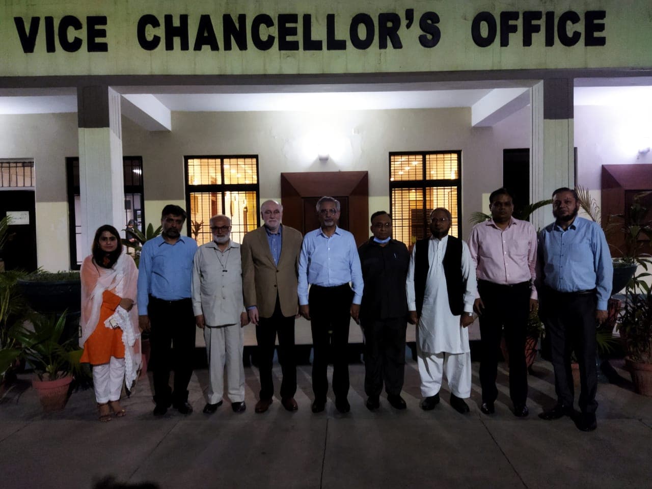 Engr. Waseem Nazir with a group of people outside the Vice Chancellor's office at UET Lahore.