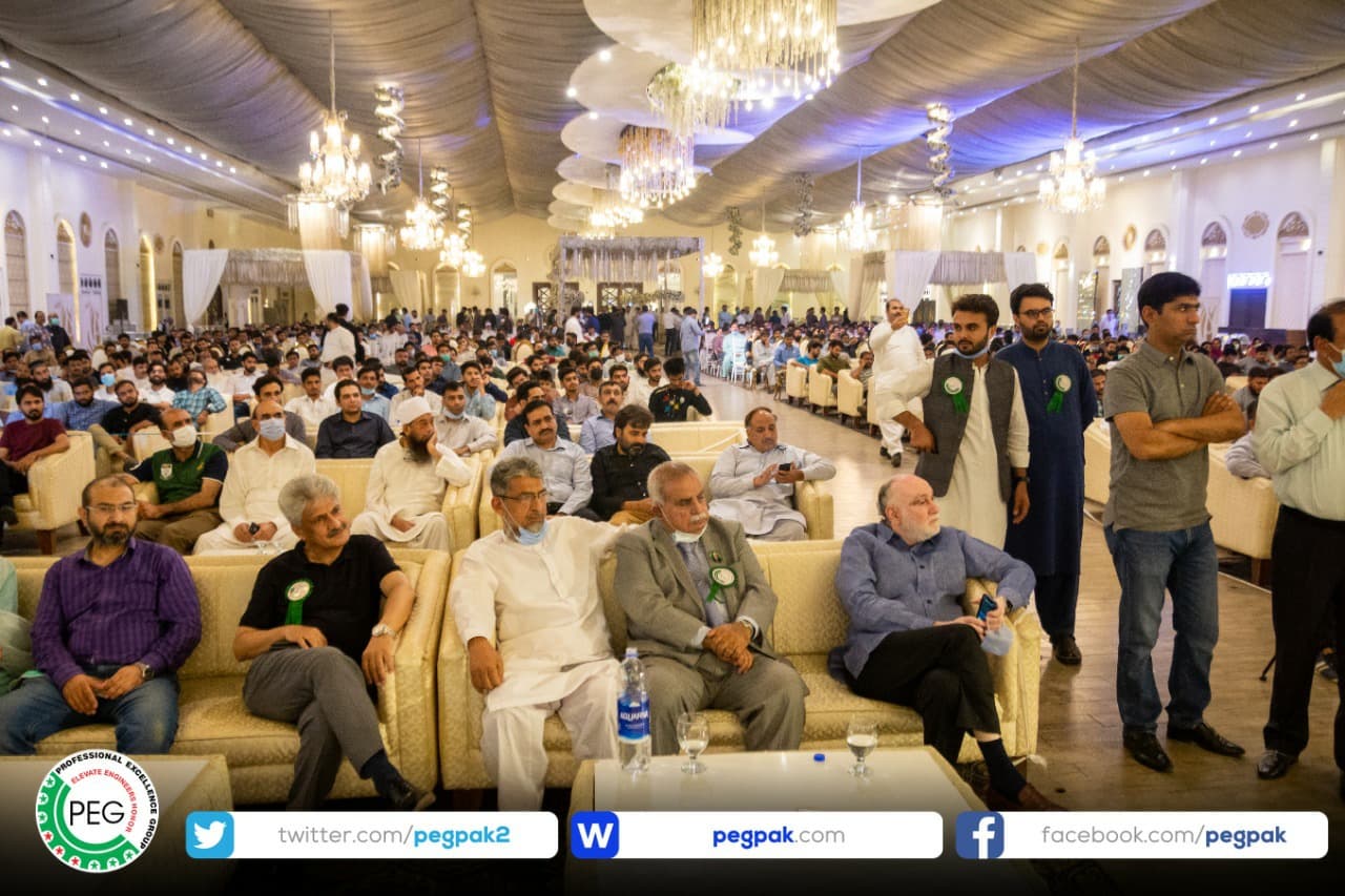 Engr. Waseem Nazir seated in the front row of a large gathering of engineers at the Faisalabad power show.
